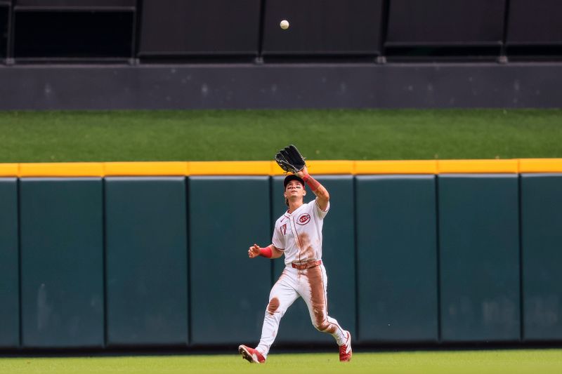 Jun 23, 2024; Cincinnati, Ohio, USA; Cincinnati Reds outfielder Stuart Fairchild (17) catches a pop up hit by Boston Red Sox shortstop Ceddanne Rafaela (not pictured) in the sixth inning at Great American Ball Park. Mandatory Credit: Katie Stratman-USA TODAY Sports