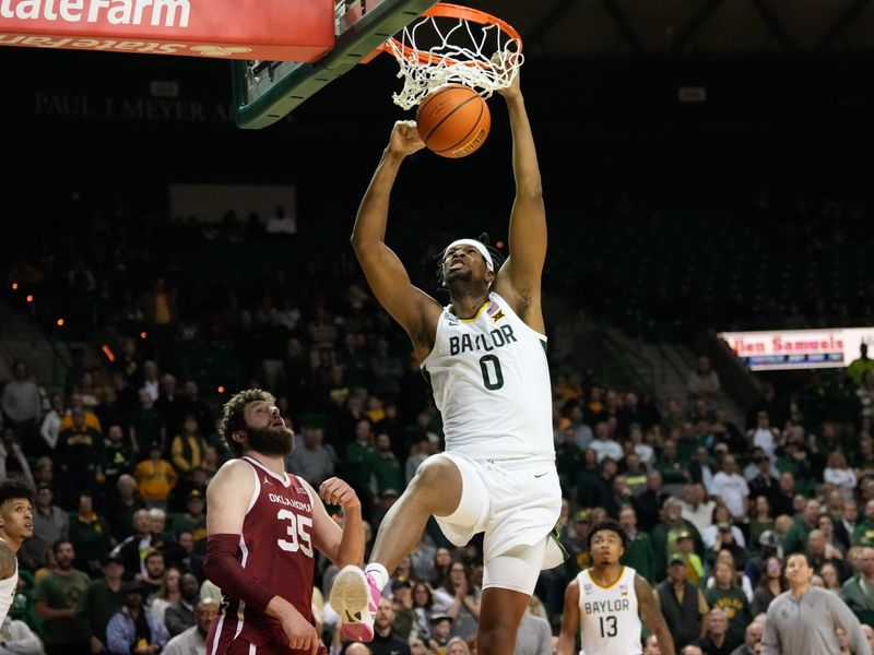 Feb 8, 2023; Waco, Texas, USA;  Baylor Bears forward Flo Thamba (0) dunks over Oklahoma Sooners forward Tanner Groves (35) during the second half at Ferrell Center. Mandatory Credit: Chris Jones-USA TODAY Sports