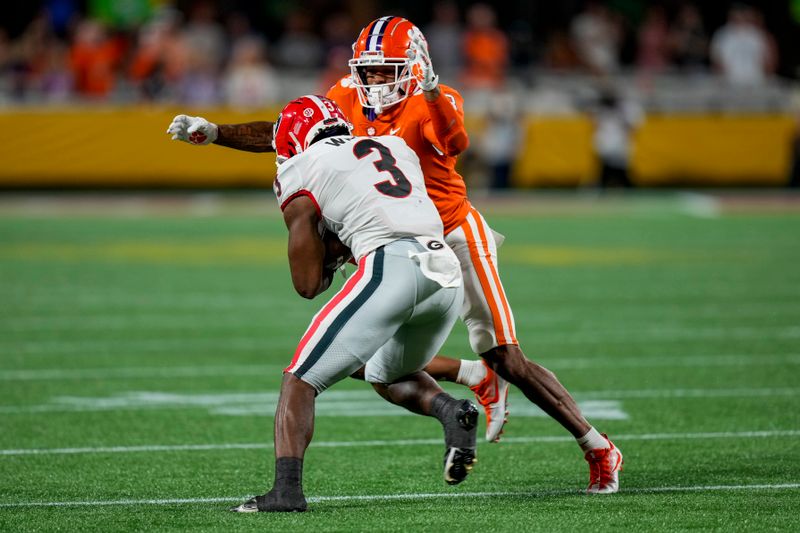 Sep 4, 2021; Charlotte, North Carolina, USA; Clemson Tigers safety Joseph Charleston (18) pursues Georgia Bulldogs running back Zamir White (3) during the second half at Bank of America Stadium. Mandatory Credit: Jim Dedmon-USA TODAY Sports