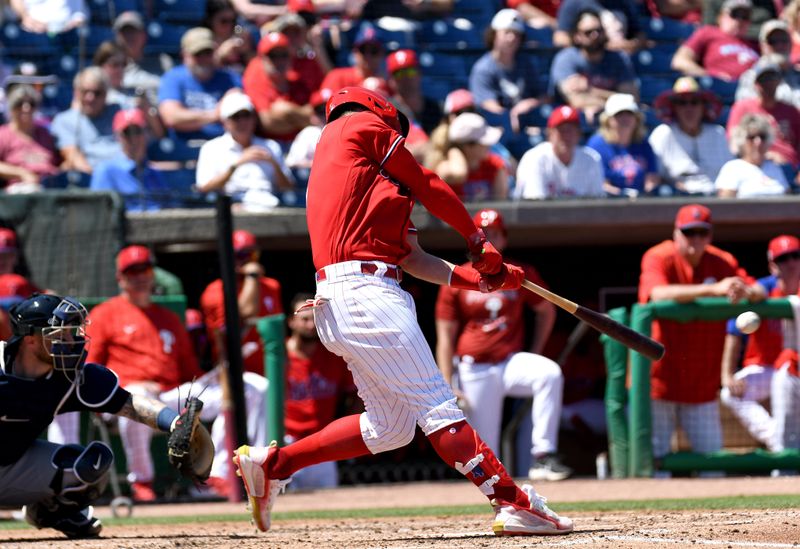 Mar 22, 2022; Clearwater, Florida, USA; Philadelphia Phillies right fielder Bryce Harper (3) hits a RBI single in the in the third inning of the game against the Detroit Tigers during spring training at BayCare Ballpark. Mandatory Credit: Jonathan Dyer-USA TODAY Sports