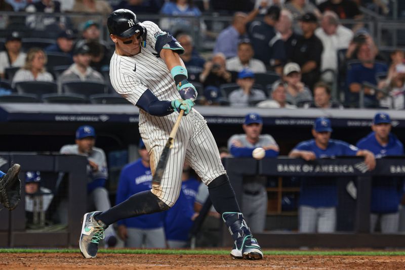 Sep 11, 2024; Bronx, New York, USA; New York Yankees center fielder Aaron Judge (99) singles during the eighth inning against the Kansas City Royals at Yankee Stadium. Mandatory Credit: Vincent Carchietta-Imagn Images