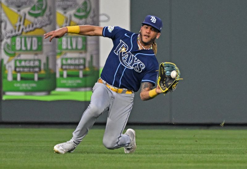 Jul 15, 2023; Kansas City, Missouri, USA;  Tampa Bay Rays center fielder Jose Siri (22) makes a sliding catch against the Kansas City Royals for the final out of the game at Kauffman Stadium. Mandatory Credit: Peter Aiken-USA TODAY Sports