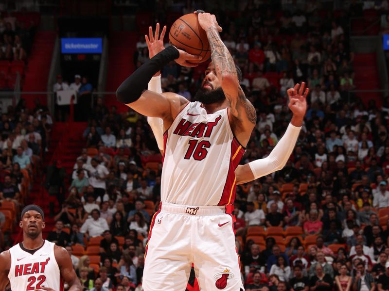 MIAMI, FL - MARCH 29: Caleb Martin #16 of the Miami Heat shoots a three point basket against the Portland Trail Blazers on March 29, 2024 at Kaseya Center in Miami, Florida. NOTE TO USER: User expressly acknowledges and agrees that, by downloading and or using this Photograph, user is consenting to the terms and conditions of the Getty Images License Agreement. Mandatory Copyright Notice: Copyright 2024 NBAE (Photo by Issac Baldizon/NBAE via Getty Images)