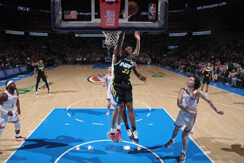 OKLAHOMA CITY, OK - MARCH 12: Aaron Nesmith #23 of the Indiana Pacers drives to the basket during the game against the Oklahoma City Thunder on March 12, 2024 at Paycom Arena in Oklahoma City, Oklahoma. NOTE TO USER: User expressly acknowledges and agrees that, by downloading and or using this photograph, User is consenting to the terms and conditions of the Getty Images License Agreement. Mandatory Copyright Notice: Copyright 2024 NBAE (Photo by Zach Beeker/NBAE via Getty Images)