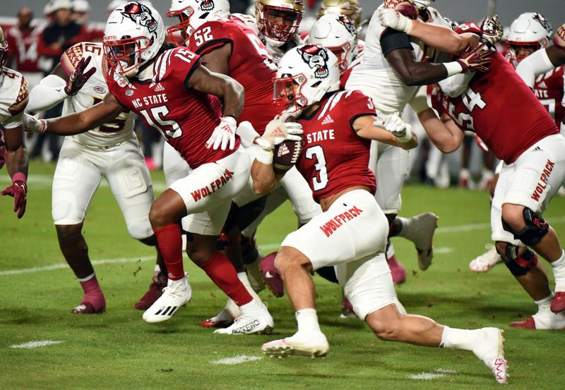 Oct 8, 2022; Raleigh, North Carolina, USA;North Carolina State Wolfpack running back Jordan Houston (3) runs the ball during the first half against the Florida State Seminoles at Carter-Finley Stadium. Mandatory Credit: Rob Kinnan-USA TODAY Sports