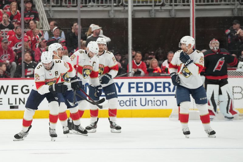 May 20, 2025; Raleigh, North Carolina, USA; Florida Panthers defenseman Aaron Ekblad (5) celebrates scoring against the Carolina Hurricanes during the first period in game one of the Eastern Conference Final of the 2025 Stanley Cup Playoffs at Lenovo Center. Mandatory Credit: James Guillory-Imagn Images