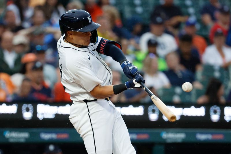 Jul 9, 2024; Detroit, Michigan, USA;  Detroit Tigers third base Gio Urshela (13) hits a three run home run in the sixth inning against the Cleveland Guardians at Comerica Park. Mandatory Credit: Rick Osentoski-USA TODAY Sports