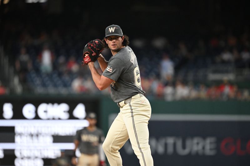 Aug 3, 2024; Washington, District of Columbia, USA; Washington Nationals relief pitcher Kyle Finnegan (67) prepares to throw a pitch against the Milwaukee Brewers during the ninth inning at Nationals Park. Mandatory Credit: Rafael Suanes-USA TODAY Sports