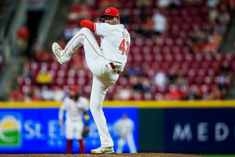 Sep 17, 2024; Cincinnati, Ohio, USA; Cincinnati Reds relief pitcher Alexis Diaz (43) prepares to pitch in the ninth inning against the Atlanta Braves at Great American Ball Park. Mandatory Credit: Katie Stratman-Imagn Images