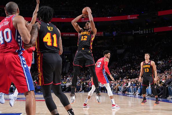 PHILADELPHIA, PA - DECEMBER 8: De'Andre Hunter #12 of the Atlanta Hawks shoots the ball during the game against the Philadelphia 76ers on December 8, 2023 at the Wells Fargo Center in Philadelphia, Pennsylvania NOTE TO USER: User expressly acknowledges and agrees that, by downloading and/or using this Photograph, user is consenting to the terms and conditions of the Getty Images License Agreement. Mandatory Copyright Notice: Copyright 2023 NBAE (Photo by Jesse D. Garrabrant/NBAE via Getty Images)