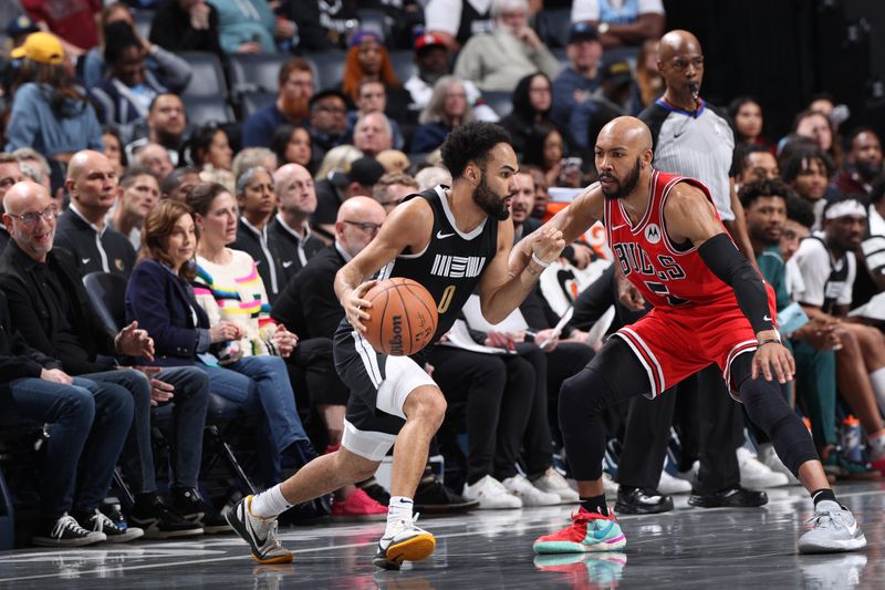 MEMPHIS, TN - FEBRUARY 8: Jacob Gilyard #0 of the Memphis Grizzlies dribbles the ball during the game against the Chicago Bulls on February 8, 2024 at FedExForum in Memphis, Tennessee. NOTE TO USER: User expressly acknowledges and agrees that, by downloading and or using this photograph, User is consenting to the terms and conditions of the Getty Images License Agreement. Mandatory Copyright Notice: Copyright 2024 NBAE (Photo by Joe Murphy/NBAE via Getty Images)