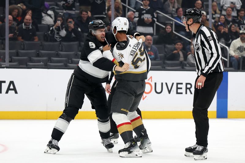 Oct 30, 2024; Los Angeles, California, USA;  Vegas Golden Knights right wing Keegan Kolesar (55) and Los Angeles Kings defenseman Andreas Englund (5) fight on the ice during the first period at Crypto.com Arena. Mandatory Credit: Kiyoshi Mio-Imagn Images