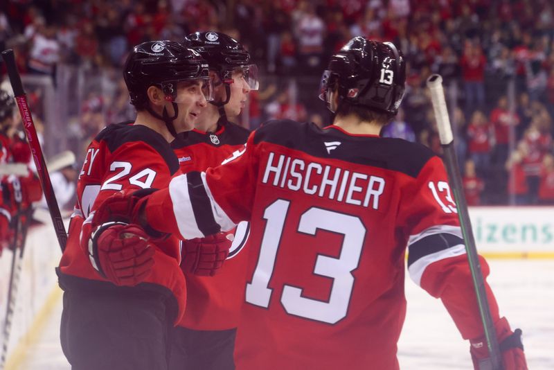 Oct 14, 2024; Newark, New Jersey, USA; New Jersey Devils defenseman Seamus Casey (24) celebrates his goal against the Utah Hockey Club during the second period at Prudential Center. Mandatory Credit: Ed Mulholland-Imagn Images