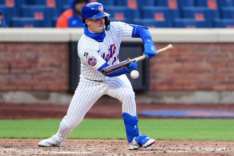 Apr 4, 2024; New York City, New York, USA; New York Mets third baseman Zack Short (21) lays down a sacrifice bunt against the Detroit Tigers during the eighth inning at Citi Field. Mandatory Credit: Gregory Fisher-USA TODAY Sports