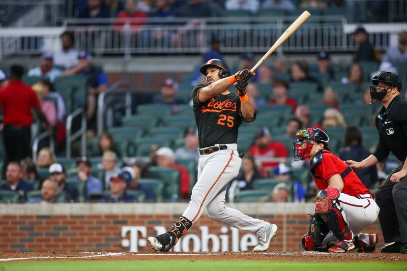 May 5, 2023; Atlanta, Georgia, USA; Baltimore Orioles right fielder Anthony Santander (25) hits a home run against the Atlanta Braves in the fourth inning at Truist Park. Mandatory Credit: Brett Davis-USA TODAY Sports