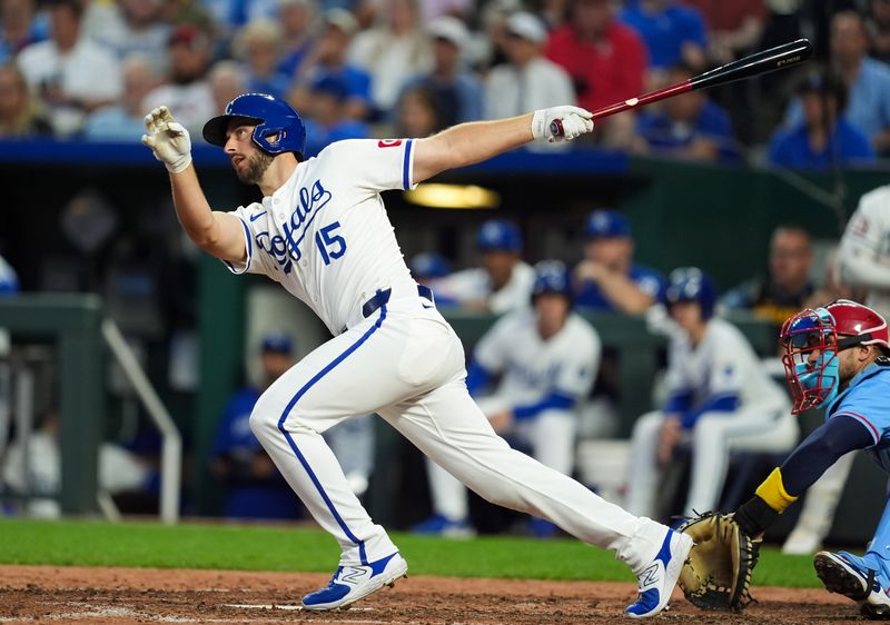 Aug 10, 2024; Kansas City, Missouri, USA; Kansas City Royals designated hitter Paul DeJong (15) hits a single against the St. Louis Cardinals during the seventh inning at Kauffman Stadium. Mandatory Credit: Jay Biggerstaff-USA TODAY Sports