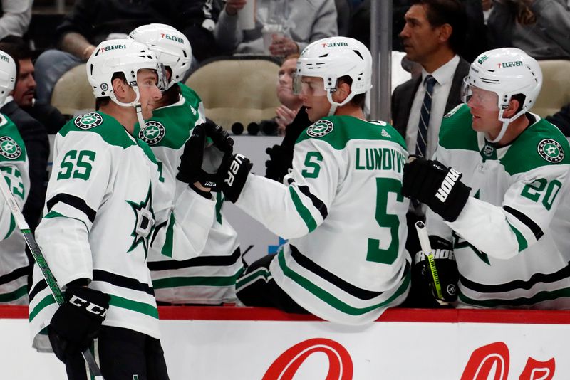 Oct 24, 2023; Pittsburgh, Pennsylvania, USA; Dallas Stars defenseman Thomas Harley (55) celebrates his goal with the Stars bench against the Pittsburgh Penguins during the third period at PPG Paints Arena. Dallas won 4-1. Mandatory Credit: Charles LeClaire-USA TODAY Sports