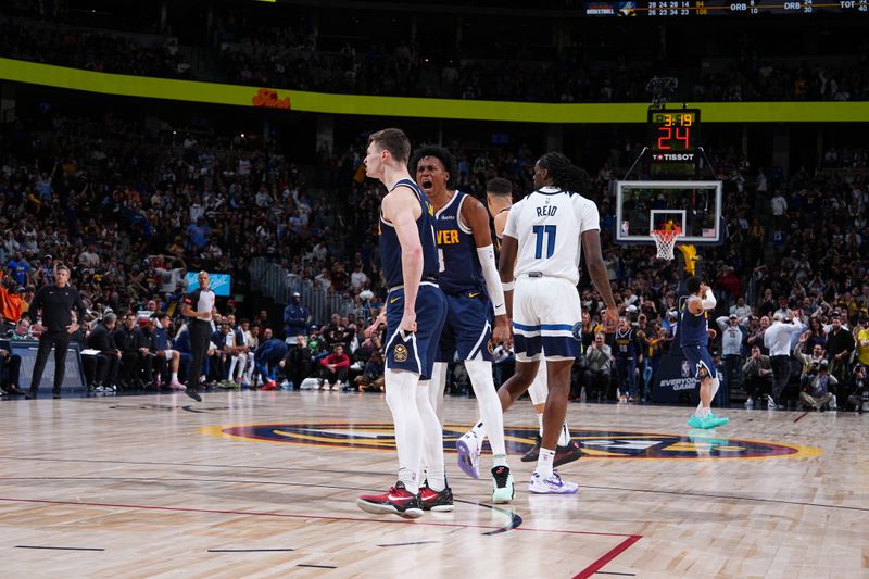 DENVER, CO - APRIL 10: Christian Braun #0 and Peyton Watson #8 of the Denver Nuggets celebrates during the game against the Minnesota Timberwolves on April 10, 2024 at the Ball Arena in Denver, Colorado. NOTE TO USER: User expressly acknowledges and agrees that, by downloading and/or using this Photograph, user is consenting to the terms and conditions of the Getty Images License Agreement. Mandatory Copyright Notice: Copyright 2024 NBAE (Photo by Garrett Ellwood/NBAE via Getty Images)