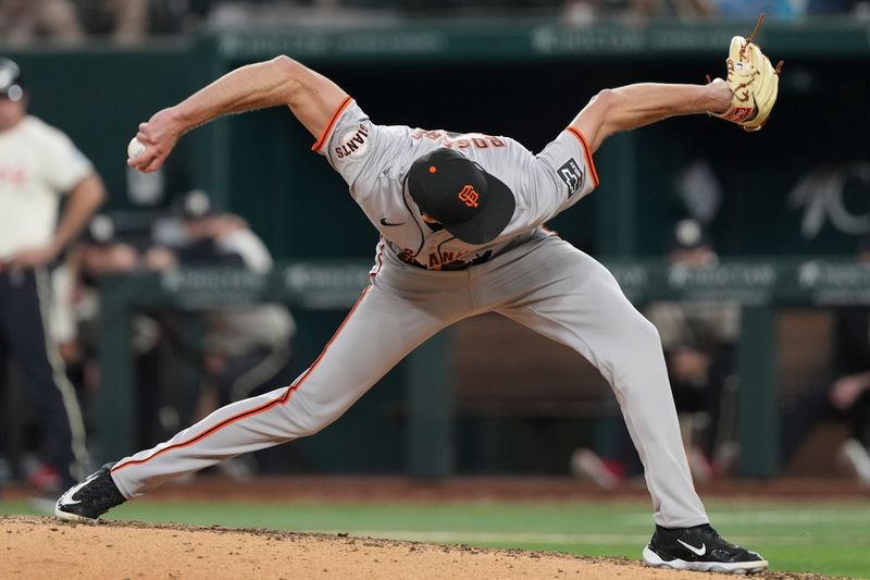 Jun 7, 2024; Arlington, Texas, USA; San Francisco Giants relief pitcher Tyler Rogers (71) delivers a pitch to the Texas Rangers during the eighth inning at Globe Life Field. Mandatory Credit: Jim Cowsert-USA TODAY Sports