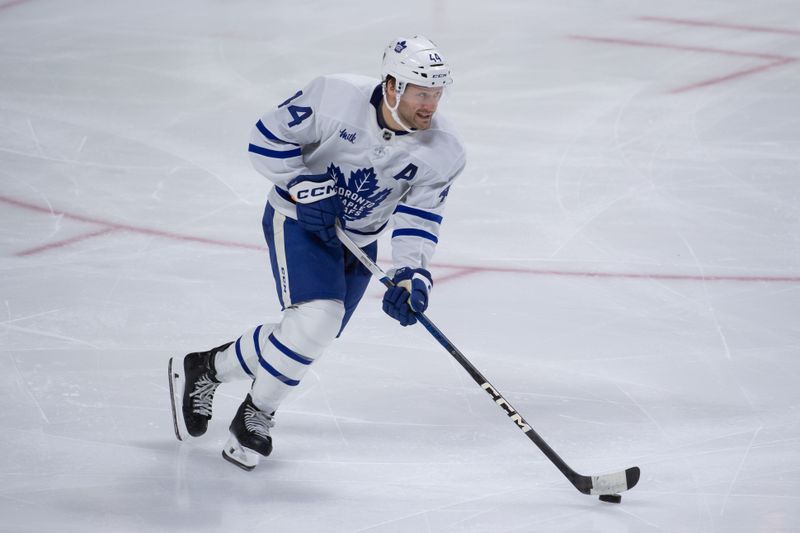 Feb 10, 2024; Ottawa, Ontario, CAN; Toronto Maple Leafs defenseman Morgan Rielly (44) skates with the puck in the third period against the Ottawa Senators at the Canadian Tire Centre. Mandatory Credit: Marc DesRosiers-USA TODAY Sports