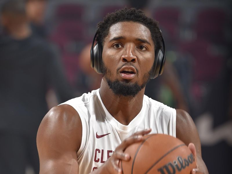 CLEVELAND, OH - OCTOBER 12: Donovan Mitchell #45 of the Cleveland Cavaliers shoots the ball before the game against the Orlando Magic on October 12, 2023 at Rocket Mortgage FieldHouse in Cleveland, Ohio. NOTE TO USER: User expressly acknowledges and agrees that, by downloading and/or using this Photograph, user is consenting to the terms and conditions of the Getty Images License Agreement. Mandatory Copyright Notice: Copyright 2023 NBAE (Photo by David Liam Kyle/NBAE via Getty Images)