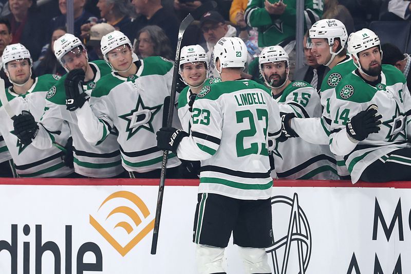 Dec 9, 2025; Winnipeg, Manitoba, CAN; Dallas Stars defenseman Esa Lindell (23) celebrates his goal against the Winnipeg Jets in the first period at Canada Life Centre. Mandatory Credit: James Carey Lauder-Imagn Images