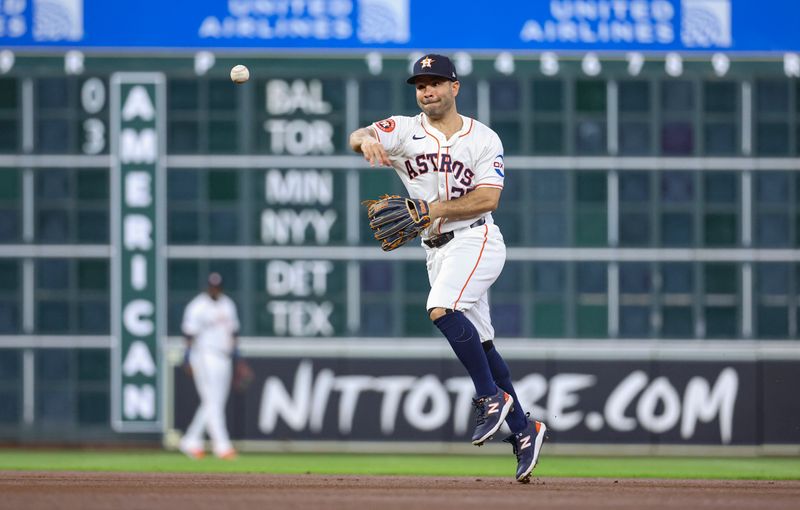 Jun 5, 2024; Houston, Texas, USA; Houston Astros second baseman Jose Altuve (27) throws out a runner at first base during the first inning against the St. Louis Cardinals at Minute Maid Park. Mandatory Credit: Troy Taormina-USA TODAY Sports