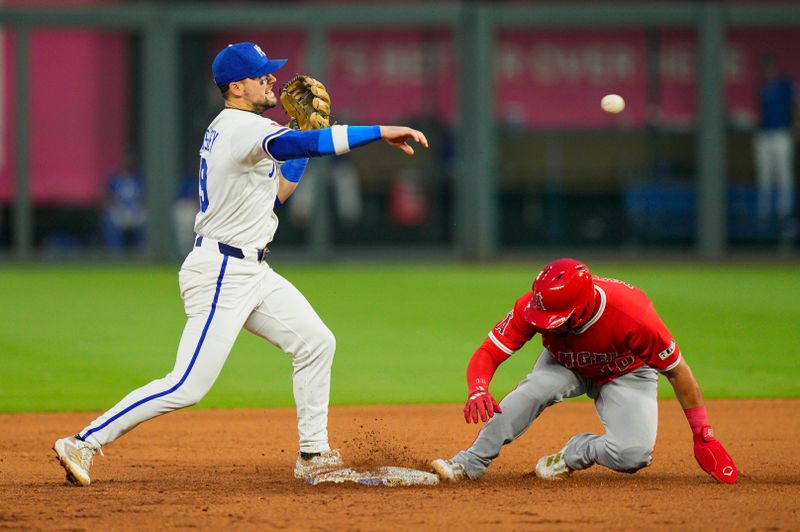 Sep 4, 2025; Kansas City, Missouri, USA; Kansas City Royals second baseman Michael Massey (19) throws to first base after forcing out Los Angeles Angels first baseman Oswald Peraza (10) during the fourth inning at Kauffman Stadium. Mandatory Credit: Jay Biggerstaff-Imagn Images