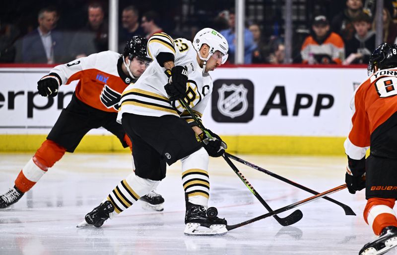 Jan 27, 2024; Philadelphia, Pennsylvania, USA; Boston Bruins left wing Brad Marchand (63) loses control of the puck against Philadelphia Flyers defenseman Cam York (8) in the third period at Wells Fargo Center. Mandatory Credit: Kyle Ross-USA TODAY Sports