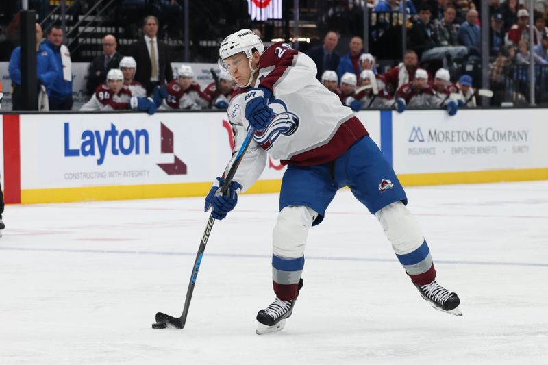 Oct 24, 2024; Salt Lake City, Utah, USA; Colorado Avalanche center Nathan MacKinnon (29) takes a shot against the Utah Hockey Club during the first period at Delta Center. Mandatory Credit: Rob Gray-Imagn Images