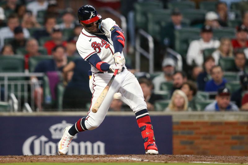 Oct 12, 2022; Atlanta, Georgia, USA; Atlanta Braves right fielder Ronald Acuna Jr. (13) hits a single against the Philadelphia Phillies in the fourth inning during game two of the NLDS for the 2022 MLB Playoffs at Truist Park. Mandatory Credit: Brett Davis-USA TODAY Sports