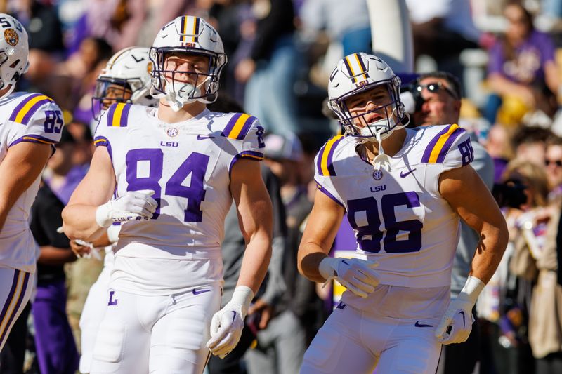 Nov 25, 2023; Baton Rouge, Louisiana, USA;  LSU Tigers tight end Mac Markway (84) and tight end Mason Taylor (86) during warmups before the game against the Texas A&M Aggies at Tiger Stadium. Mandatory Credit: Stephen Lew-USA TODAY Sports