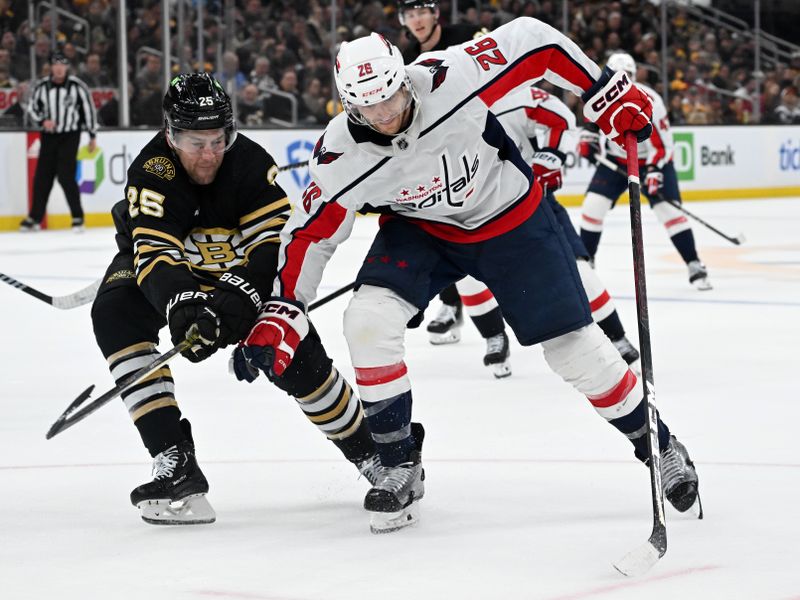 Feb 10, 2024; Boston, Massachusetts, USA; Washington Capitals right wing Nic Dowd (26) skates against Boston Bruins defenseman Brandon Carlo (25) during the second period at the TD Garden. Mandatory Credit: Brian Fluharty-USA TODAY Sports