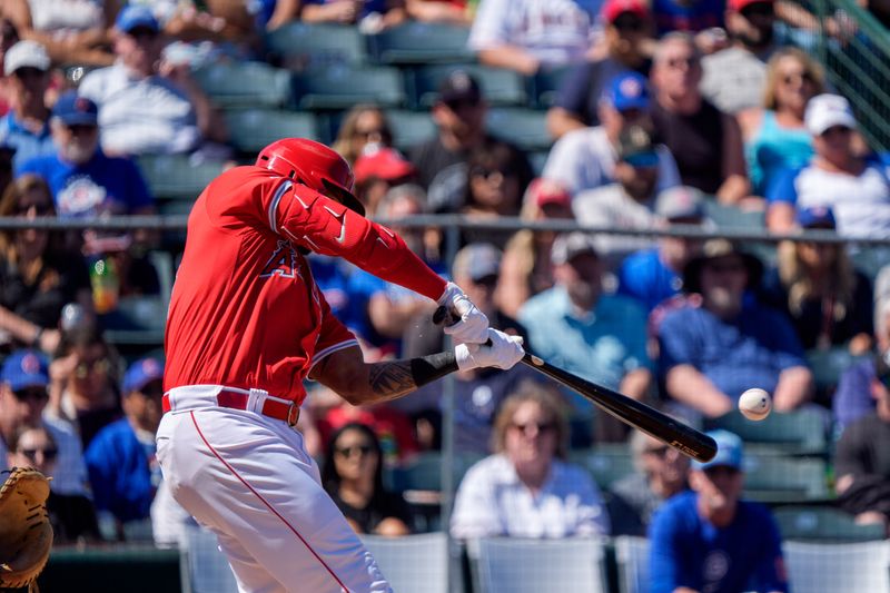 Mar 16, 2024; Tempe, Arizona, USA; Los Angeles Angels outfielder Aaron Hicks (12) singles in the first during a spring training game against the Chicago Cubs at Tempe Diablo Stadium. Mandatory Credit: Allan Henry-USA TODAY Sports