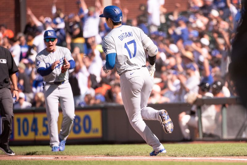 Jun 29, 2024; San Francisco, California, USA; Los Angeles Dodgers two-way player Shohei Ohtani (17) rounds first base after hitting a home run against the San Francisco Giants during the third inning at Oracle Park. Mandatory Credit: Ed Szczepanski-USA TODAY Sports