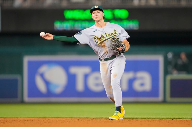 Aug 11, 2023; Washington, District of Columbia, USA;  Oakland Athletics second baseman Zack Gelof (20) throws out Washington Nationals designated hitter Joey Meneses (not pictured) after fielding a ground ball during the fifth inning at Nationals Park. Mandatory Credit: Gregory Fisher-USA TODAY Sports