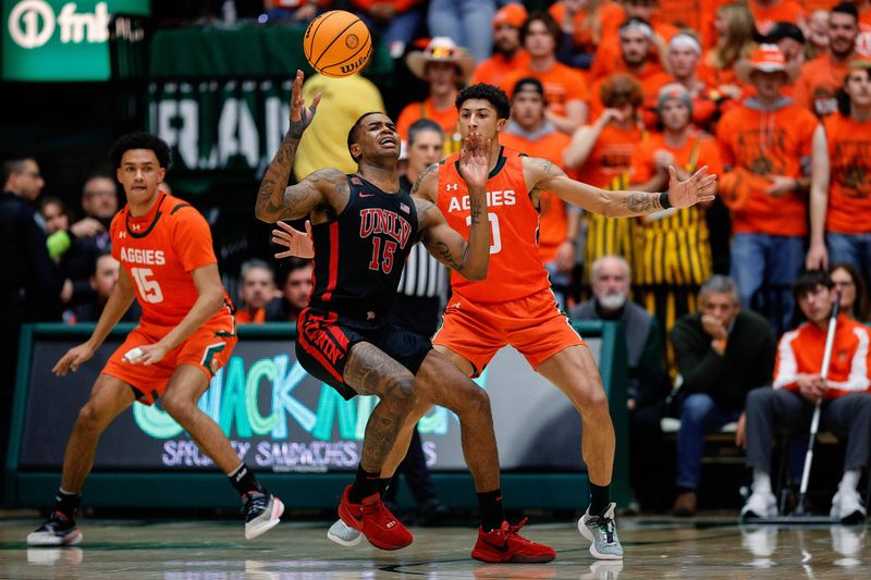 Jan 19, 2024; Fort Collins, Colorado, USA; UNLV Rebels guard Luis Rodriguez (15) loses control of the ball ahead of Colorado State Rams guard Nique Clifford (10) in the second half at Moby Arena. Mandatory Credit: Isaiah J. Downing-USA TODAY Sports