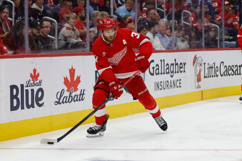 Oct 17, 2024; Detroit, Michigan, USA;  Detroit Red Wings left wing J.T. Compher (37) skates with the puck in the first period against the New York Rangers at Little Caesars Arena. Mandatory Credit: Rick Osentoski-Imagn Images