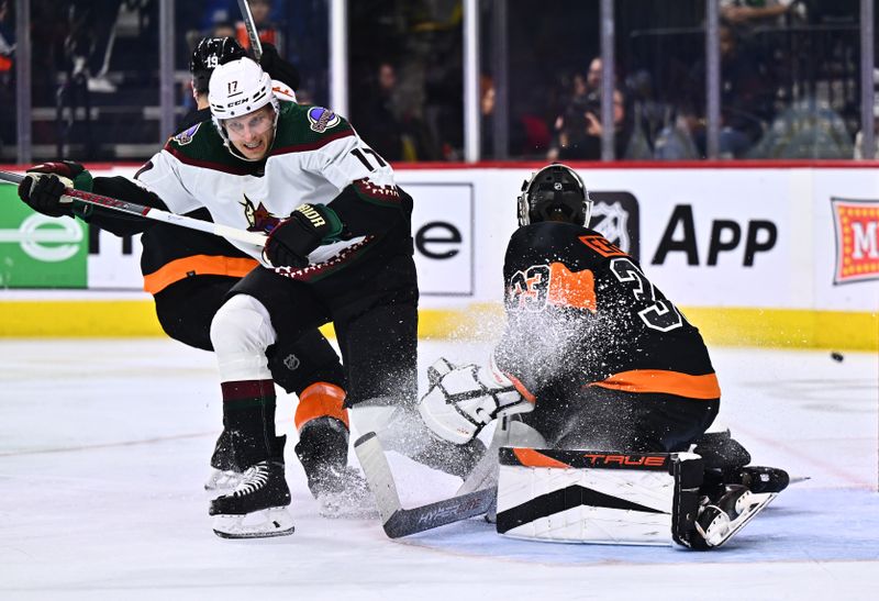 Feb 12, 2024; Philadelphia, Pennsylvania, USA; Arizona Coyotes center Nick Bjugstad (17) collides with Philadelphia Flyers right wing Garnet Hathaway (19) and goalie Samuel Ersson (33) in the second period at Wells Fargo Center. Mandatory Credit: Kyle Ross-USA TODAY Sports