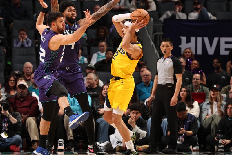 CHARLOTTE, NC - February 12: Andrew Nembhard #2 of the Indiana Pacers handles the ball during the game against the Charlotte Hornets on February 12, 2024 at Spectrum Center in Charlotte, North Carolina. NOTE TO USER: User expressly acknowledges and agrees that, by downloading and or using this photograph, User is consenting to the terms and conditions of the Getty Images License Agreement. Mandatory Copyright Notice: Copyright 2024 NBAE (Photo by Kent Smith/NBAE via Getty Images)