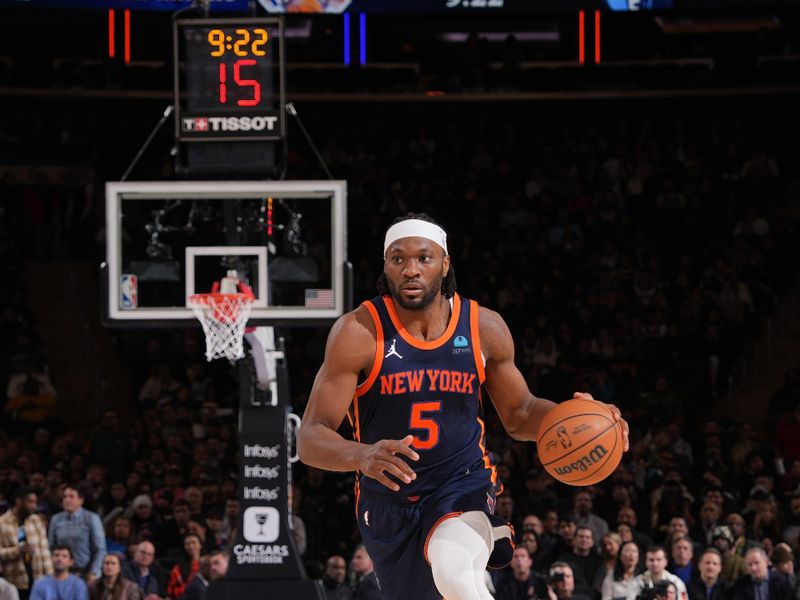 NEW YORK, NY - FEBRUARY 6: Precious Achiuwa #5 of the New York Knicks drives to the basket during the game against the Memphis Grizzlies on February 6, 2024 at Madison Square Garden in New York City, New York.  NOTE TO USER: User expressly acknowledges and agrees that, by downloading and or using this photograph, User is consenting to the terms and conditions of the Getty Images License Agreement. Mandatory Copyright Notice: Copyright 2024 NBAE  (Photo by Jesse D. Garrabrant/NBAE via Getty Images)