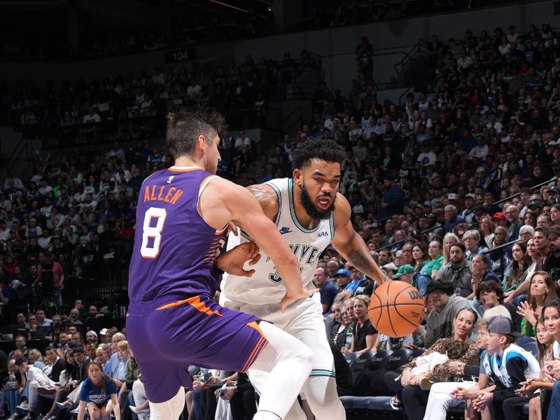 MINNEAPOLIS, MN -  APRIL 14: Karl-Anthony Towns #32 of the Minnesota Timberwolves handles the ball during the game against the Phoenix Suns on April 14, 2024 at Target Center in Minneapolis, Minnesota. NOTE TO USER: User expressly acknowledges and agrees that, by downloading and or using this Photograph, user is consenting to the terms and conditions of the Getty Images License Agreement. Mandatory Copyright Notice: Copyright 2024 NBAE (Photo by Jordan Johnson/NBAE via Getty Images)