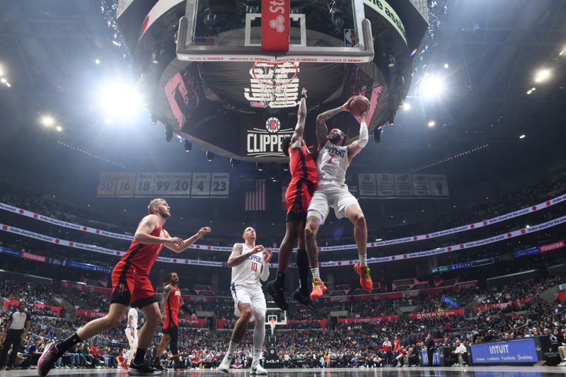 LOS ANGELES, CA - APIRL 14: Amir Coffey #7 of the LA Clippers drives to the basket during the game against the Houston Rockets on April 14, 2024 at Crypto.Com Arena in Los Angeles, California. NOTE TO USER: User expressly acknowledges and agrees that, by downloading and/or using this Photograph, user is consenting to the terms and conditions of the Getty Images License Agreement. Mandatory Copyright Notice: Copyright 2024 NBAE (Photo by Adam Pantozzi/NBAE via Getty Images)