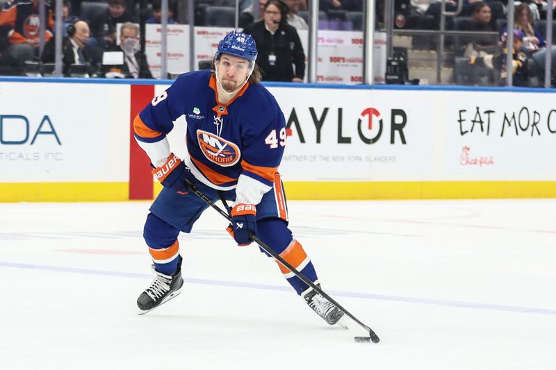 Nov 23, 2025; Elmont, New York, USA;  New York Islanders right wing Max Shabanov (49) looks to pass the puck in the first period against the Seattle Kraken at UBS Arena. Mandatory Credit: Wendell Cruz-Imagn Images