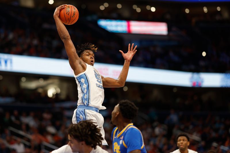 Mar 15, 2024; Washington, D.C., USA; Pittsburgh Panthers forward Zack Austin (55) leaps to rebound the ball against the Pittsburgh Panthers in the first half at Capital One Arena. Mandatory Credit: Geoff Burke-USA TODAY Sports