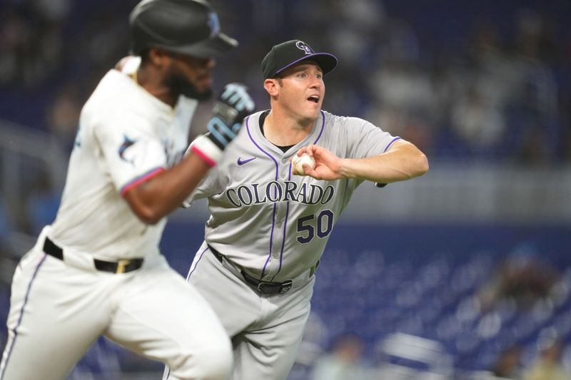 May 2, 2024; Miami, Florida, USA;  Colorado Rockies pitcher Ty Blach (50) fields a ground ball hit by Miami Marlins designated hitter Bryan De La Cruz (14) and throws him out at first base in the seventh inning at loanDepot Park. Mandatory Credit: Jim Rassol-USA TODAY Sports