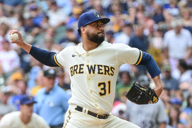 Aug 9, 2023; Milwaukee, Wisconsin, USA;  Milwaukee Brewers pitcher Joel Payamps (31) throws against the Colorado Rockies in the eighth inning at American Family Field. Mandatory Credit: Benny Sieu-USA TODAY Sports