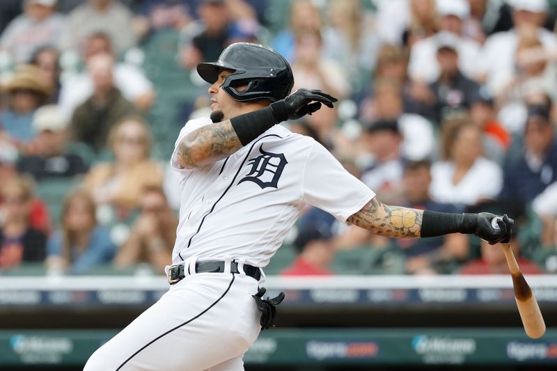 Jun 11, 2023; Detroit, Michigan, USA; Detroit Tigers shortstop Javier Baez (28) hits a single in the first inning against the Arizona Diamondbacks at Comerica Park. Mandatory Credit: Rick Osentoski-USA TODAY Sports