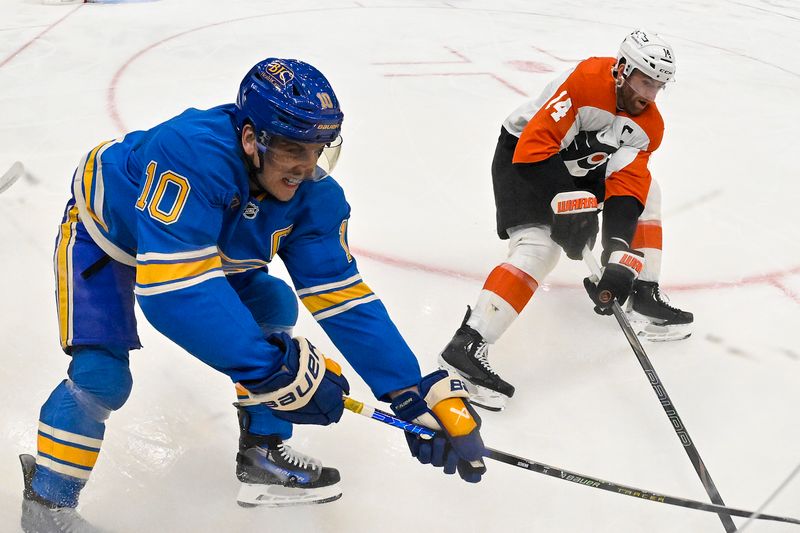 Nov 30, 2024; St. Louis, Missouri, USA;  St. Louis Blues center Brayden Schenn (10) and Philadelphia Flyers center Sean Couturier (14) battle for the puck during the first period at Enterprise Center. Mandatory Credit: Jeff Curry-Imagn Images