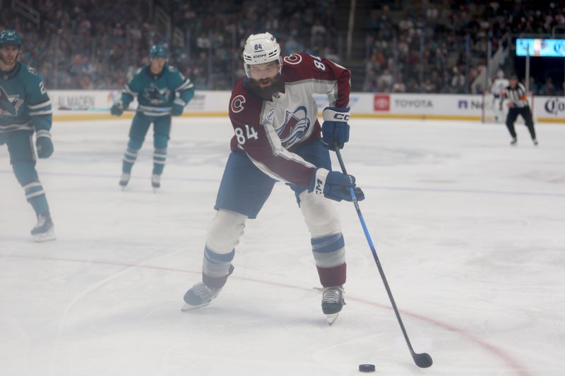 Nov 1, 2025; San Jose, California, USA; Colorado Avalanche defenseman Brent Burns (84) controls the puck against the San Jose Sharks during the second period at SAP Center at San Jose. Mandatory Credit: Dennis Lee-Imagn Images